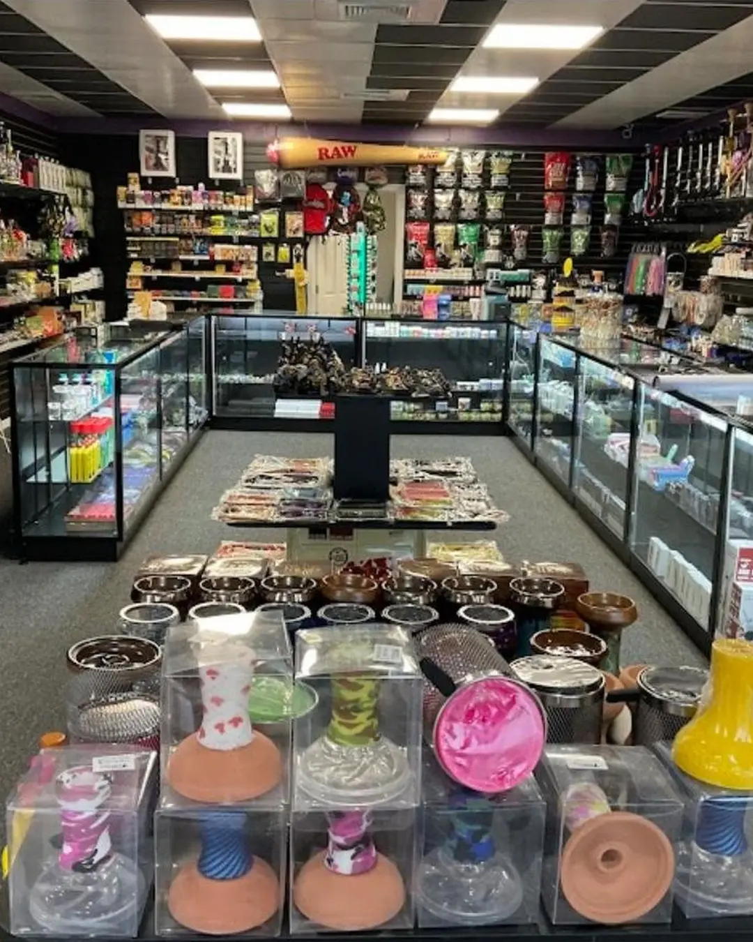 Wide view of aisles and glass display counters inside the former shop