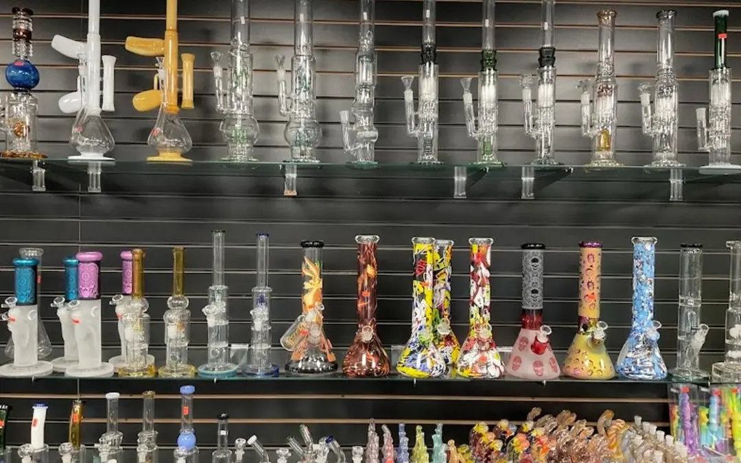 Glass water pipes on wall shelves inside the former shop
