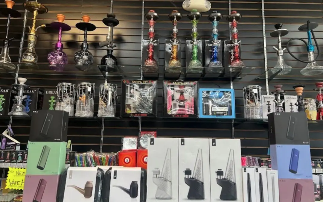 Hookahs displayed on wall shelves inside the former shop