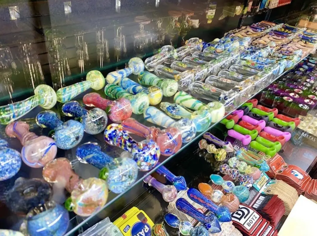 Colorful glass hand pipes in a counter display