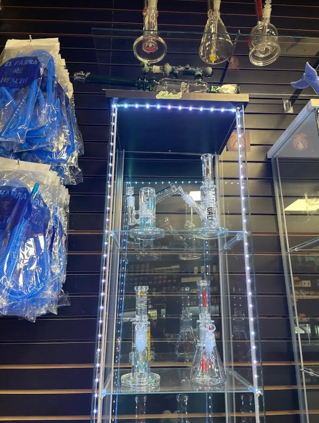 Glass rigs in a lit display cabinet