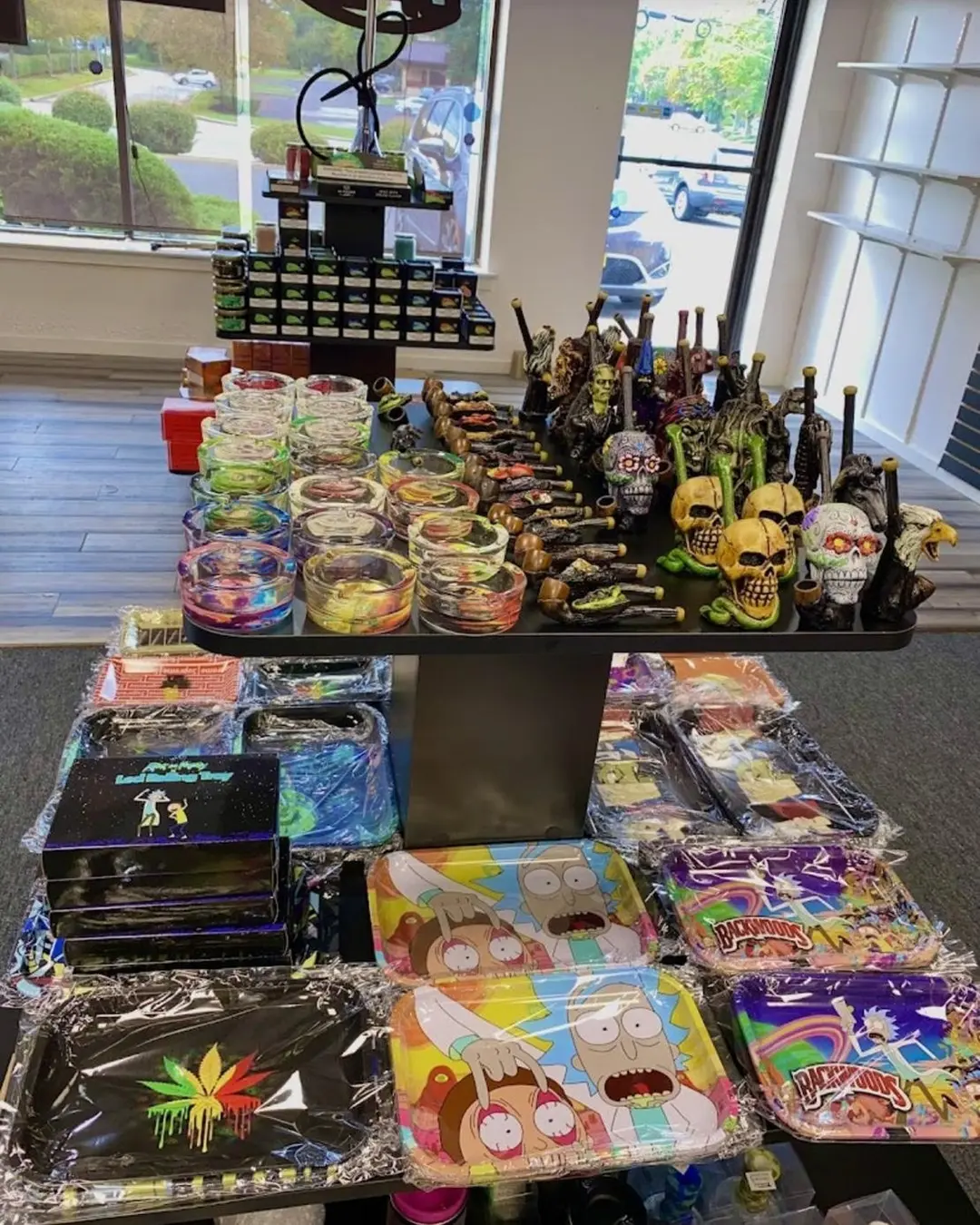 Retail counter with ashtrays, trays, and glass accessories